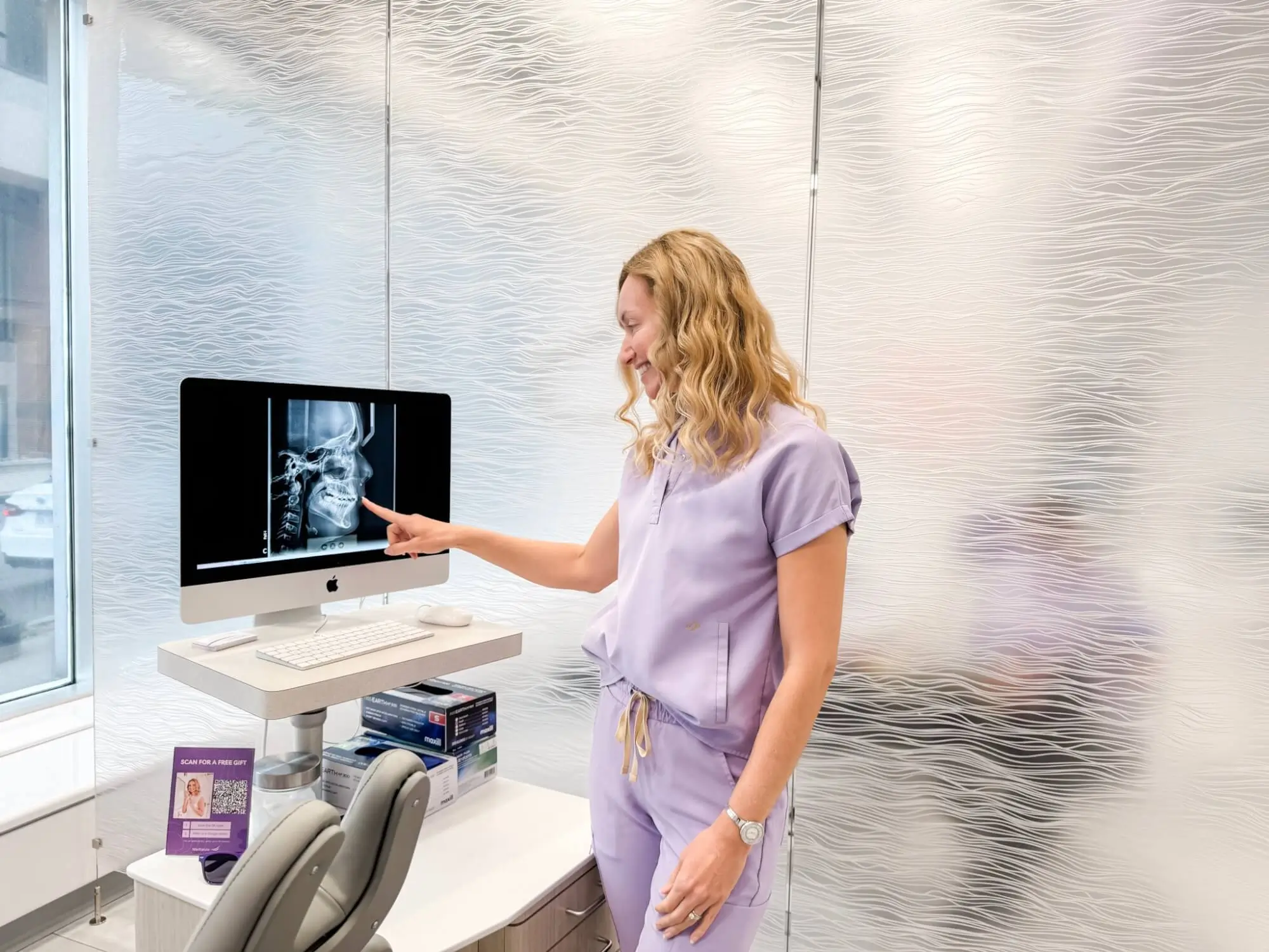 Dr. MacKenzie reviewing an x-ray at MacKenzie Orthodontics